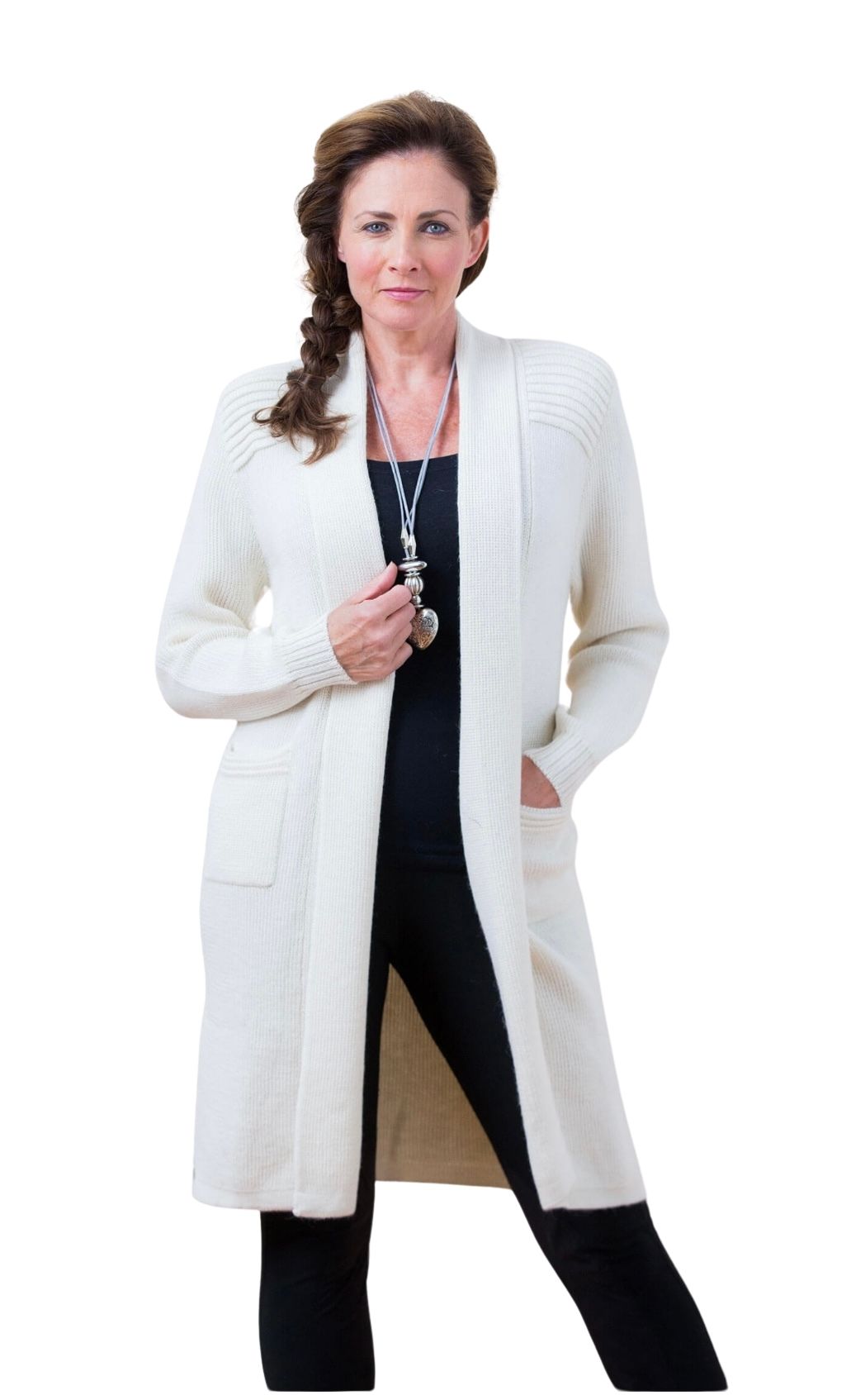 Woman wearing an ivory alpaca long open sweater, front view