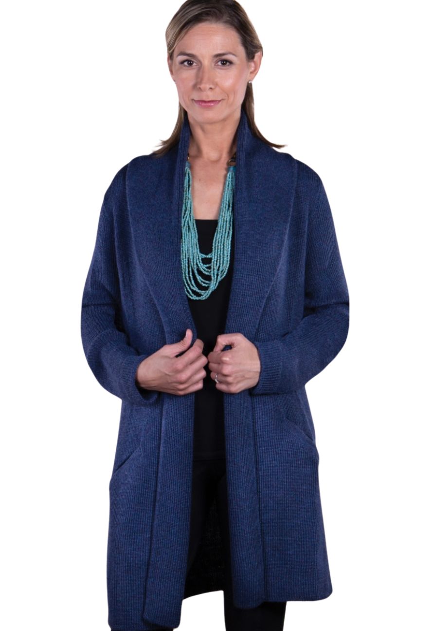 Woman in a blue alpaca long cardigan, front view