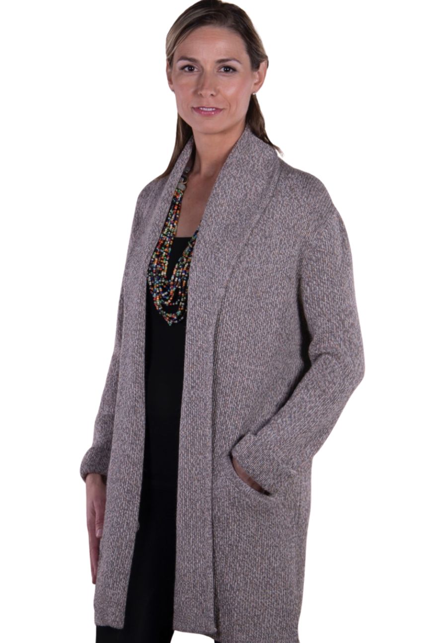 Woman wearing a tan alpaca long cardigan, front view