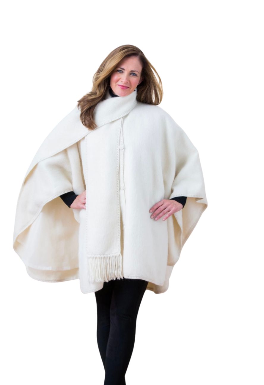 Ivory alpaca cape with fringed scarf, front view on model