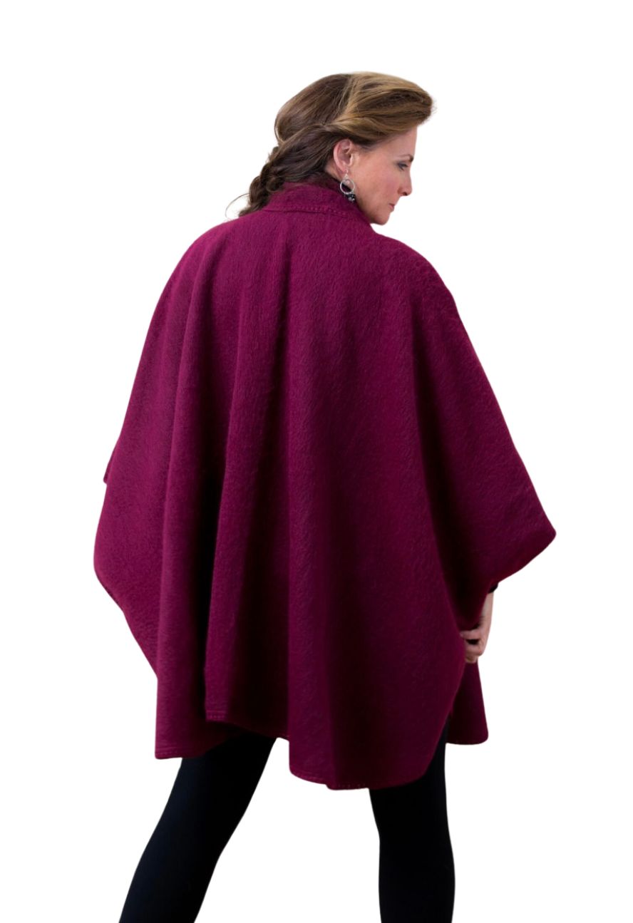 Burgundy alpaca cape with scarf, back view on model
