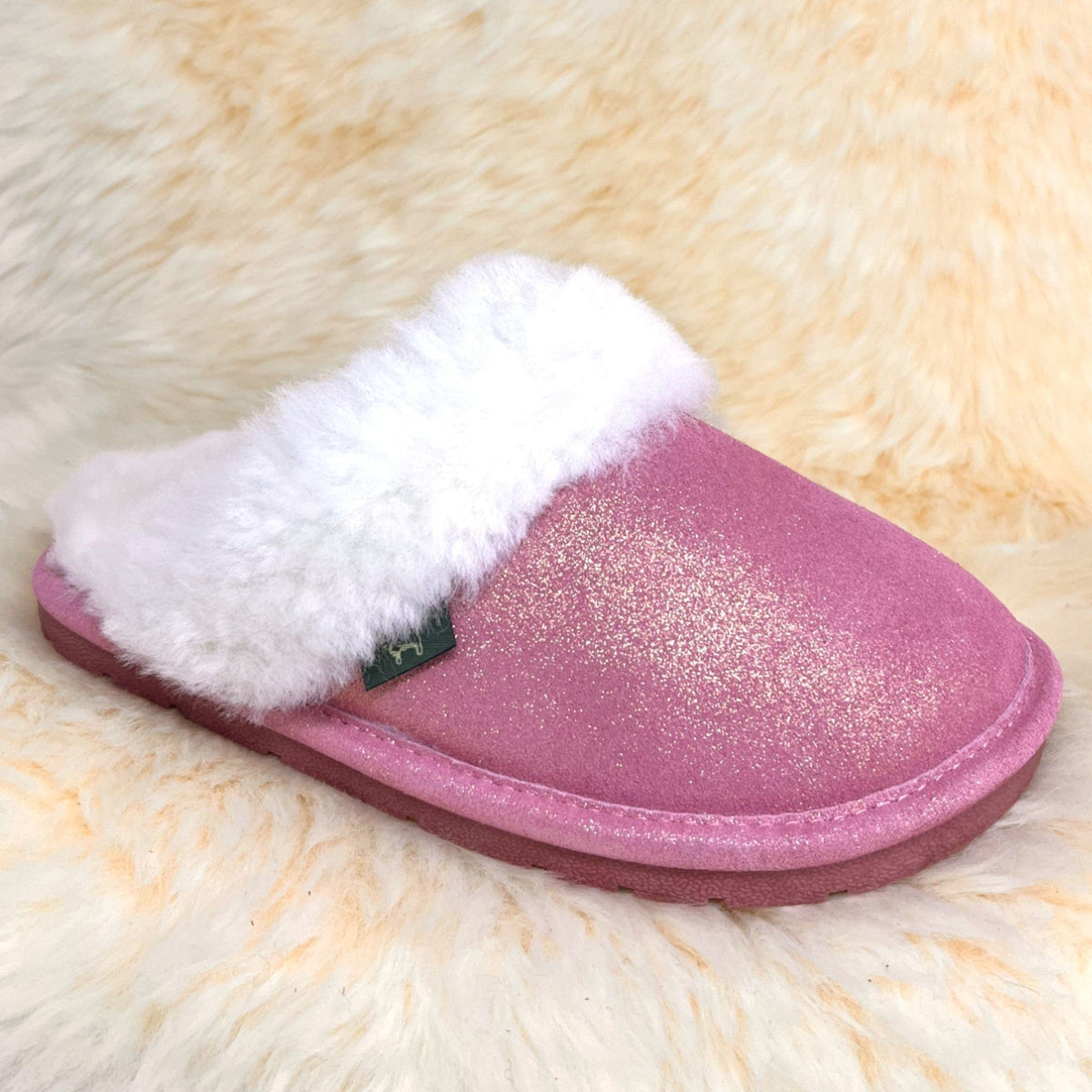 Rose gold sheepskin scuff slipper with plush white collar, side view