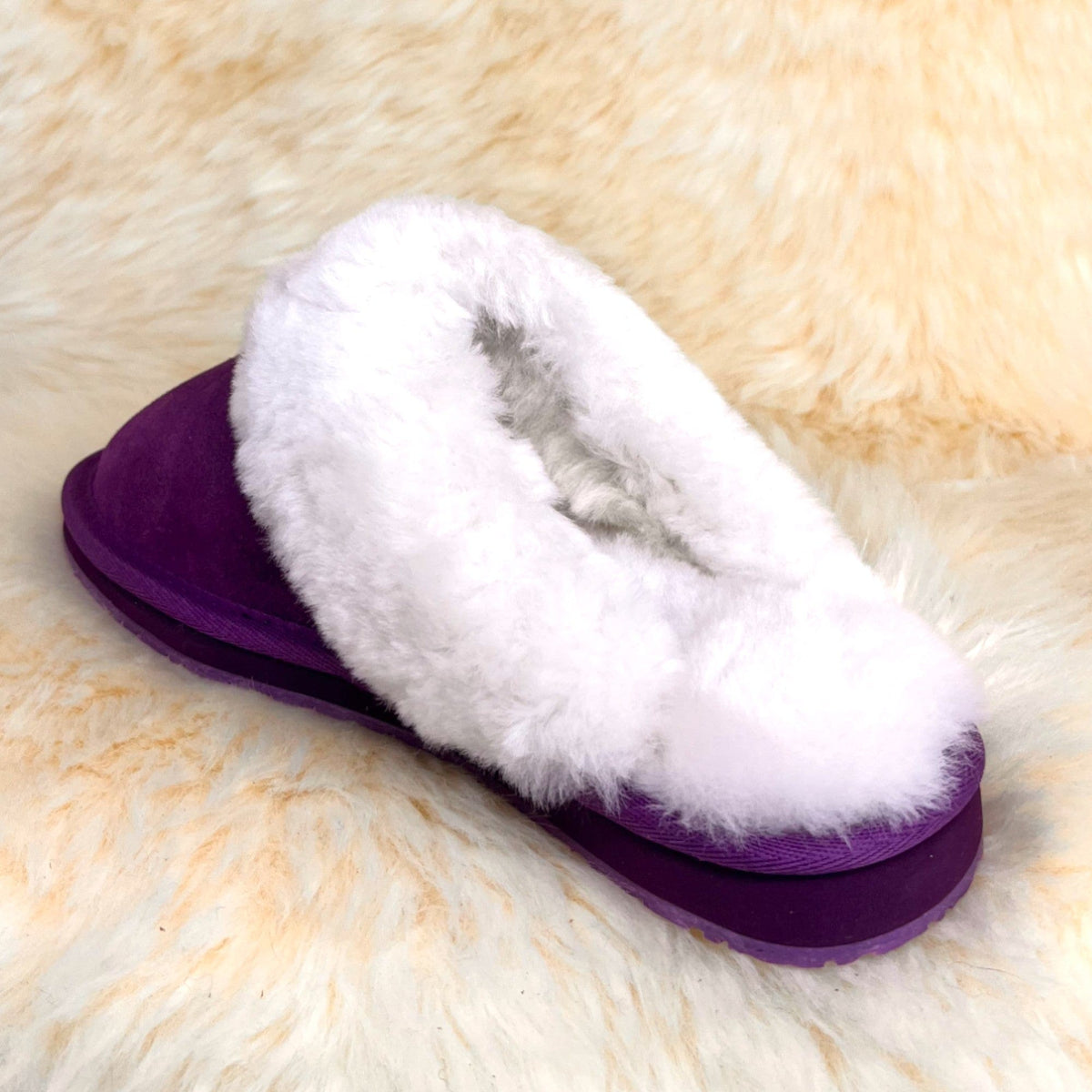 Women's purple sheepskin scuff slipper, rear angle