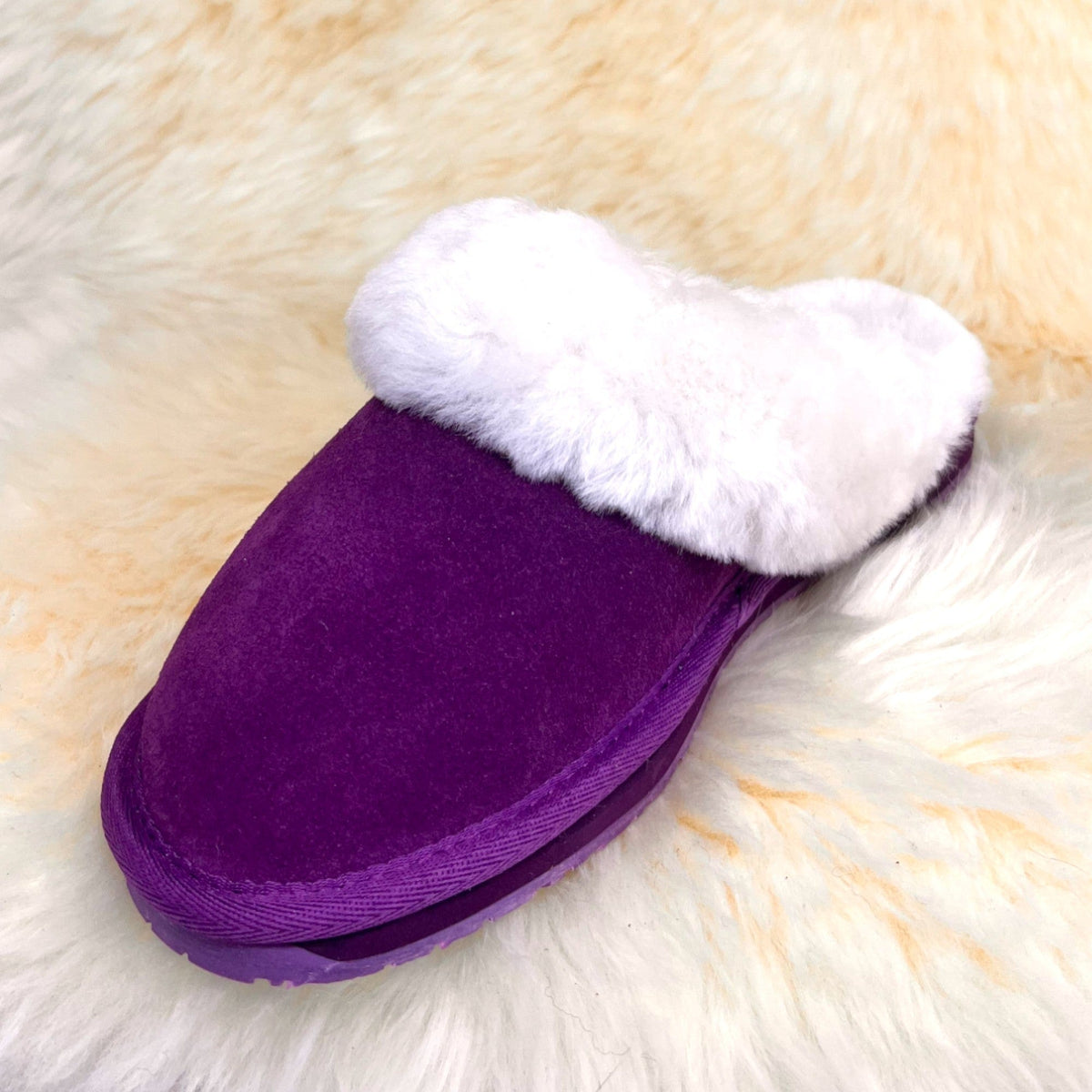 Women's purple sheepskin scuff slipper, front three-quarter view