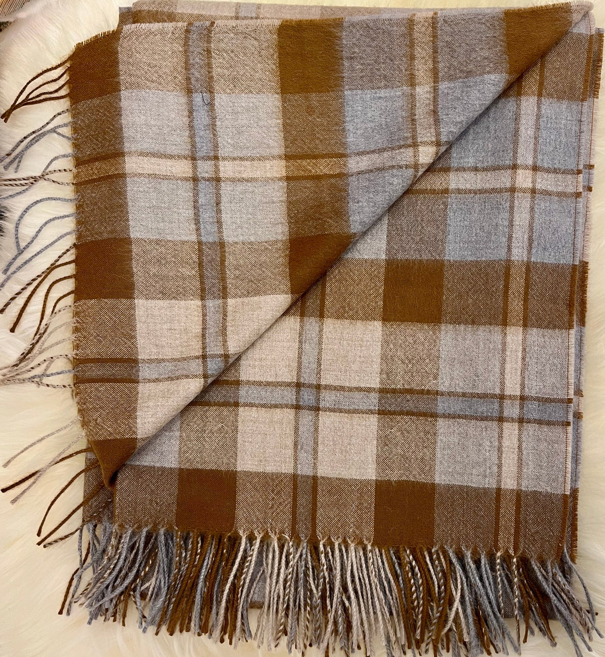 Folded toffee tartan plaid alpaca throw with fringe